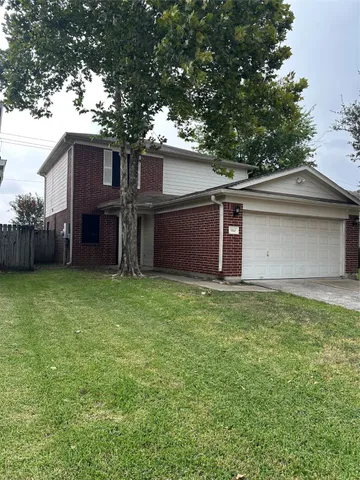 a house with a tree in front of it