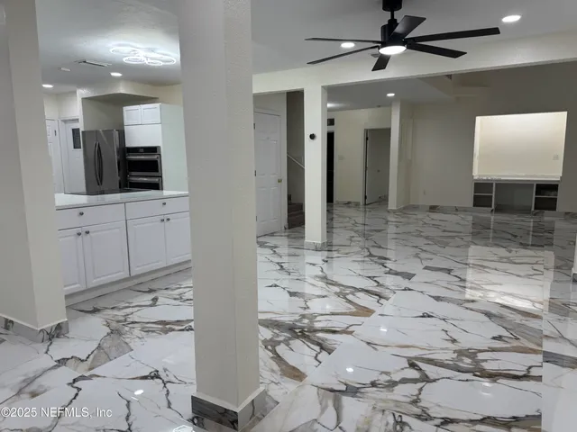 a view of a bathroom with mirror