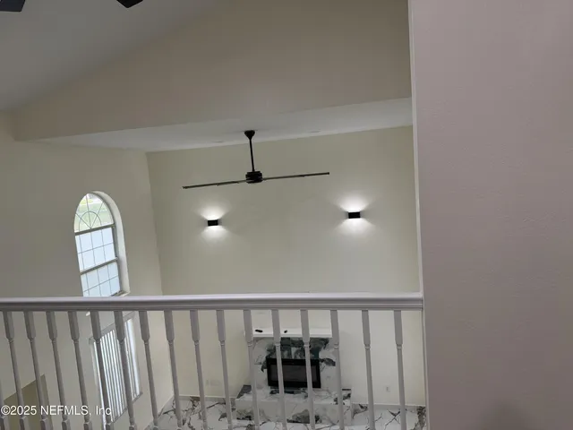 a view of staircase with wooden floor