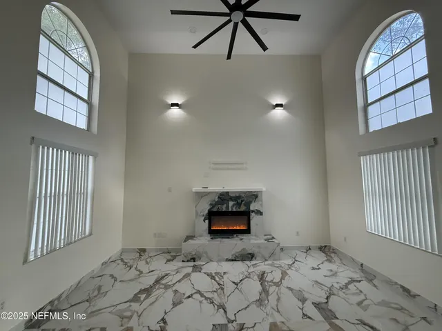 a bedroom with bed and window