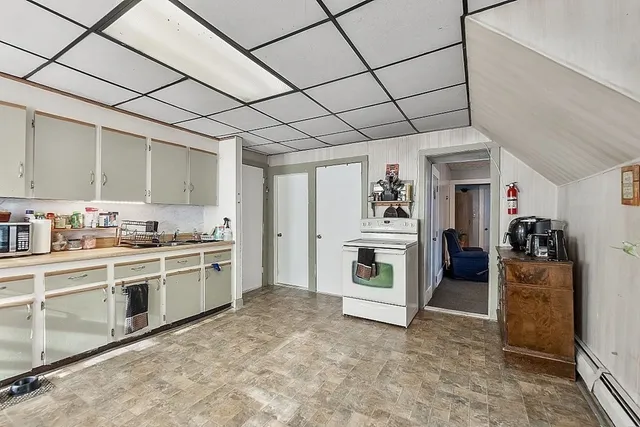 a kitchen with stainless steel appliances granite countertop a stove and a refrigerator