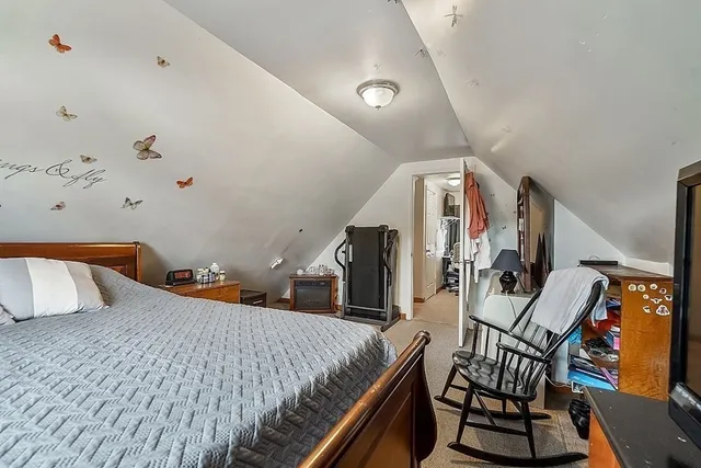 a bedroom with furniture and wooden floor