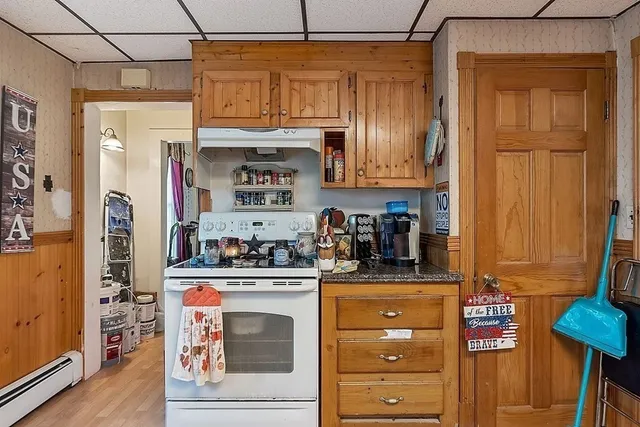 a kitchen with stainless steel appliances granite countertop a stove and a refrigerator