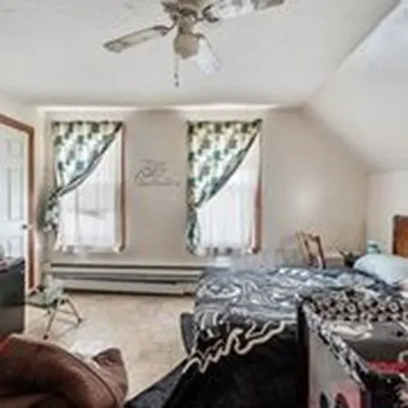 a kitchen with a stove and a window