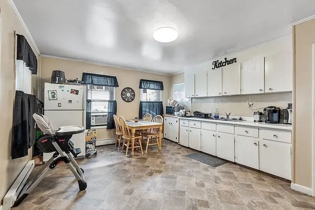 a kitchen with sink cabinets and outdoor space