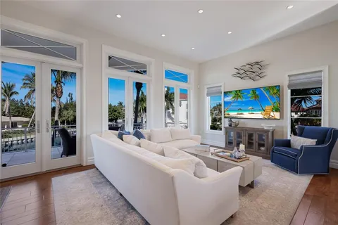 a living room with furniture fireplace and window