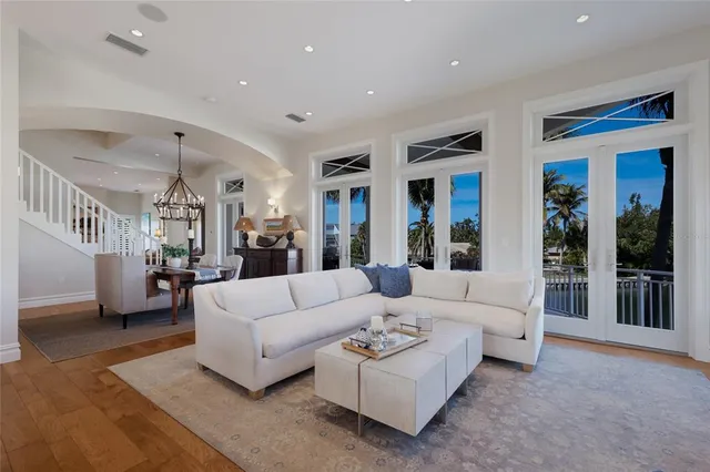 a spacious bedroom with a bed and a flat screen tv