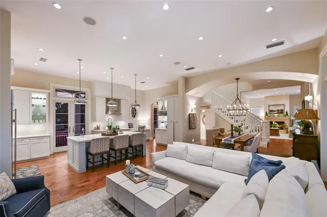 a spacious bathroom with a toilet sink and mirror