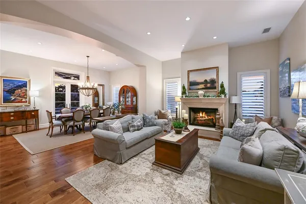 a spacious bedroom with a bed and a flat screen tv