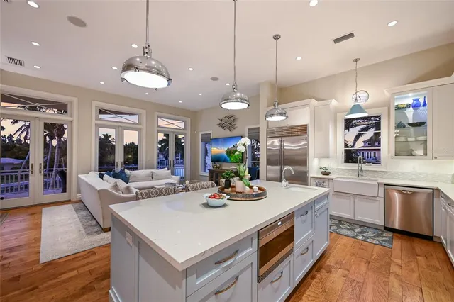 a bedroom with a large bed and a potted plant