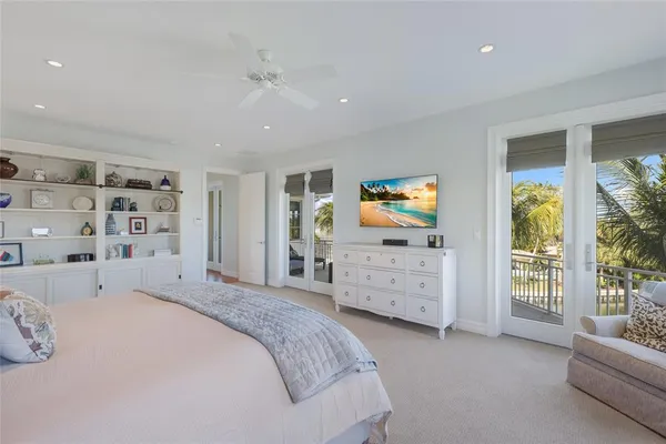 a bed room with a bed window and a chair