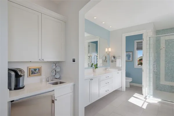 a bath room with a toilet a sink and a bath tub