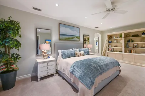 a view of a lake with a table and chairs