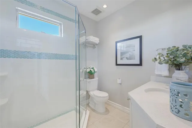 a swimming pool with outdoor seating and yard