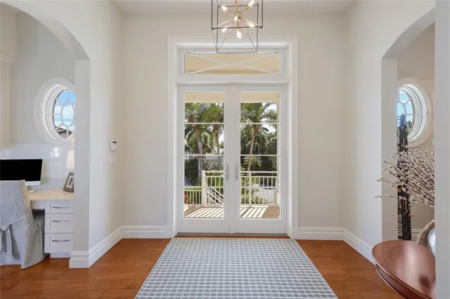a living room with furniture fireplace and window