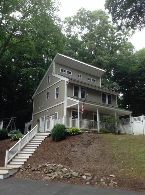 2099 Durham Road Guilford, CT 06437 - Photo 1 of 1 a front view of a house with a garden