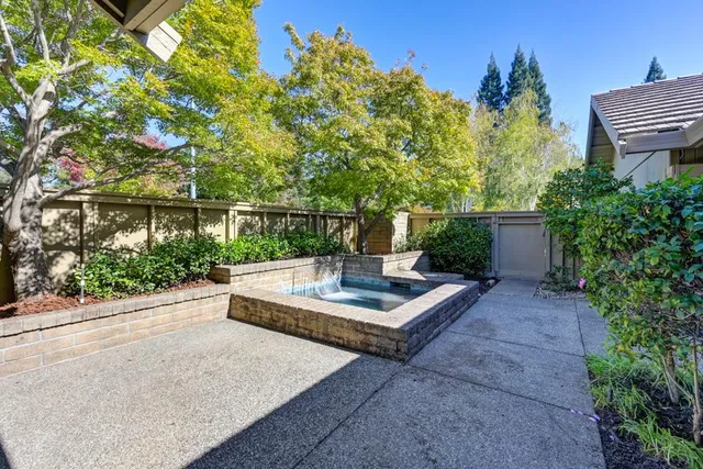 a view of a house with backyard and porch