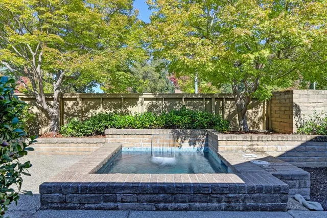 a view of a livingroom with furniture and a fireplace
