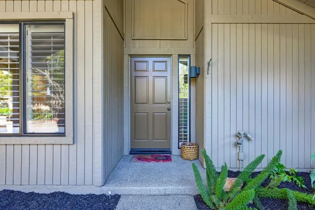 a view of a livingroom with furniture and garden