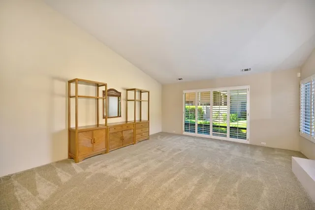 a kitchen with a stove a refrigerator a sink and wooden cabinets