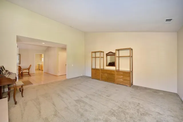 a kitchen with a sink and wooden floor