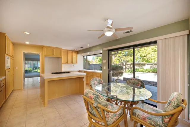 an empty room with closet and fan