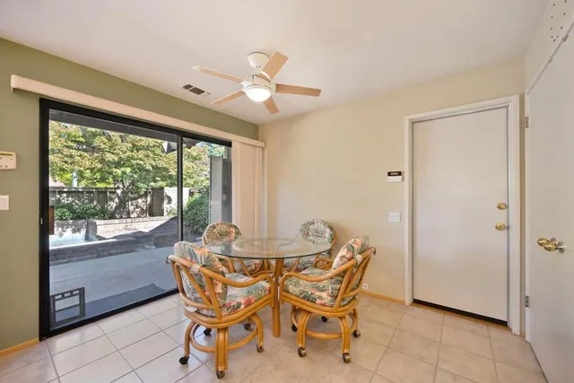 a view of a kitchen with a sink and a refrigerator