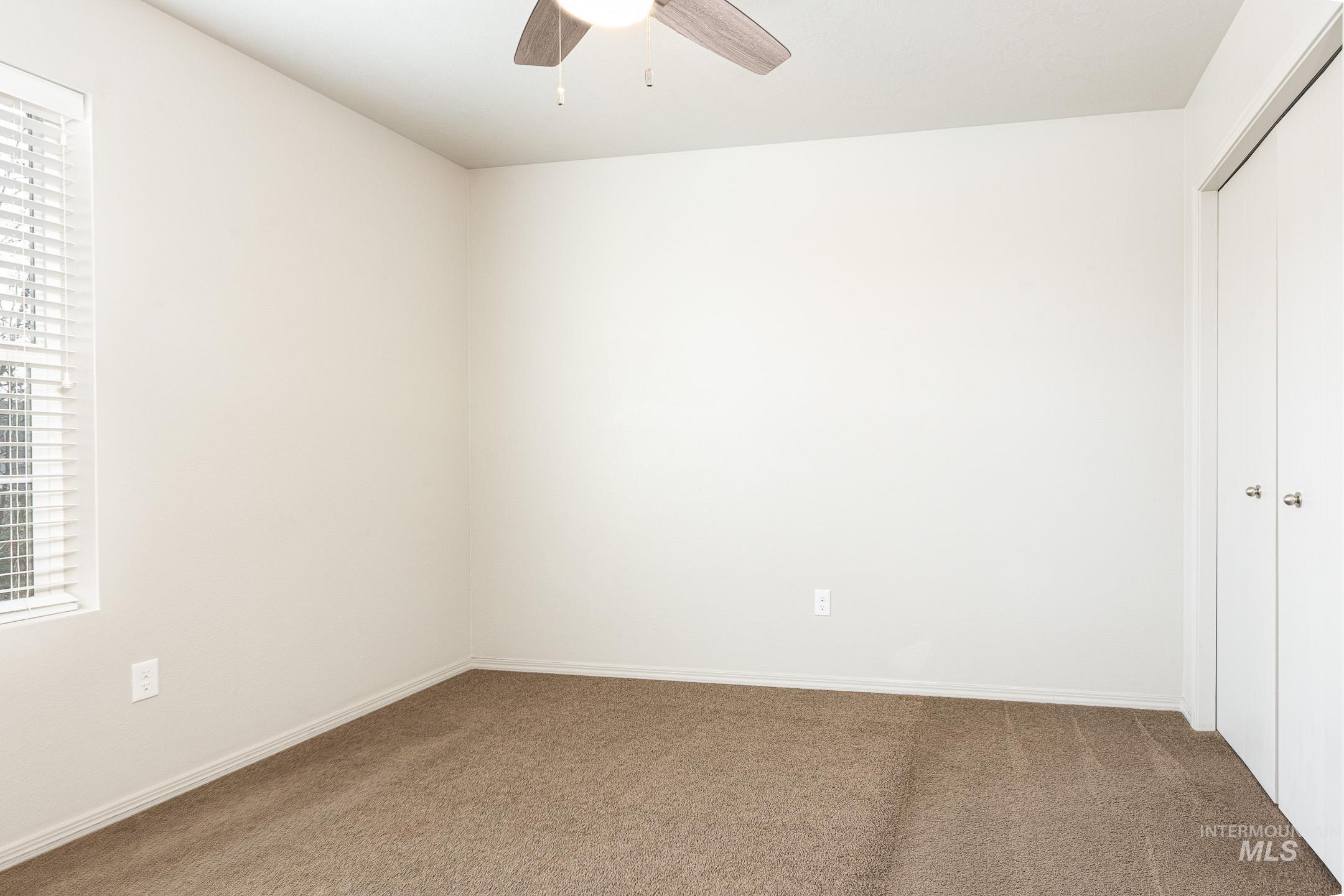 643 North Manship Avenue Meridian, ID 83642 - Photo 23 of 32 Unfurnished bedroom with a closet, carpet flooring, and ceiling fan