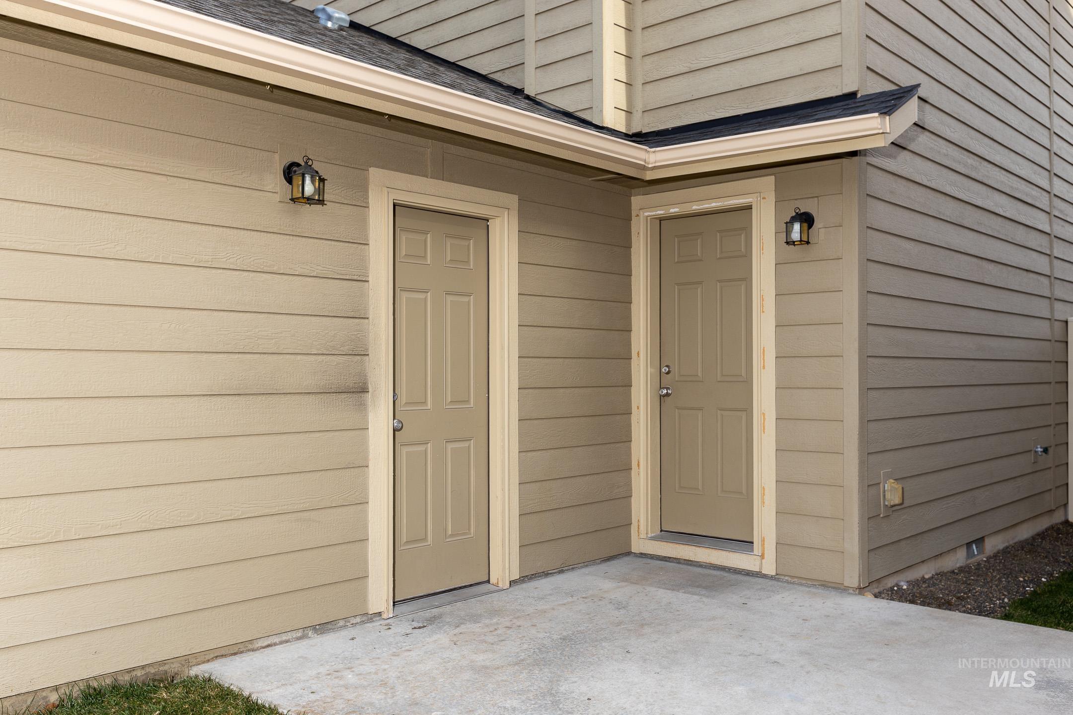 643 North Manship Avenue Meridian, ID 83642 - Photo 26 of 32 Property entrance featuring a shingled roof and a patio area