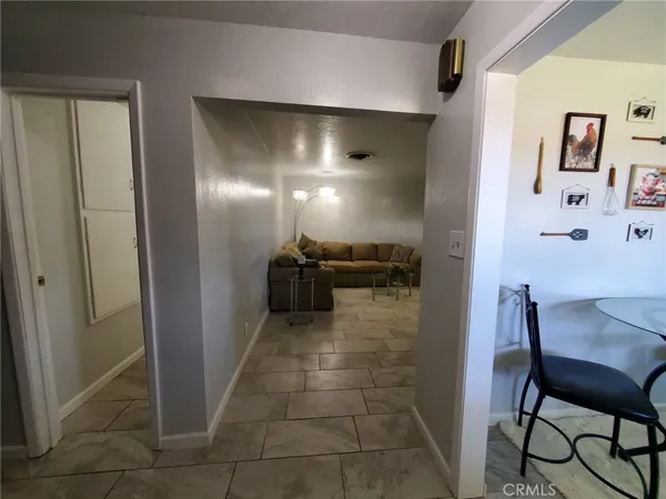 a view of a hallway with seating area