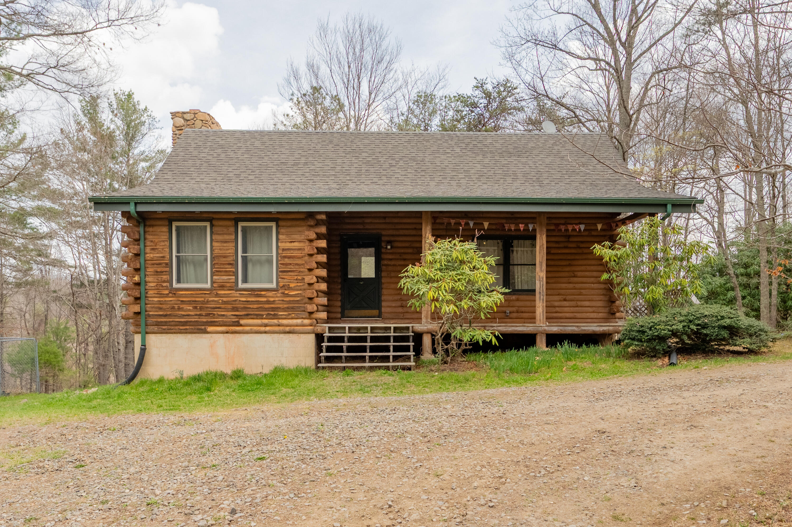 183 Pine Mountain Road Northeast Floyd, VA 24091 - Photo 1 of 54 a front view of a house with garden
