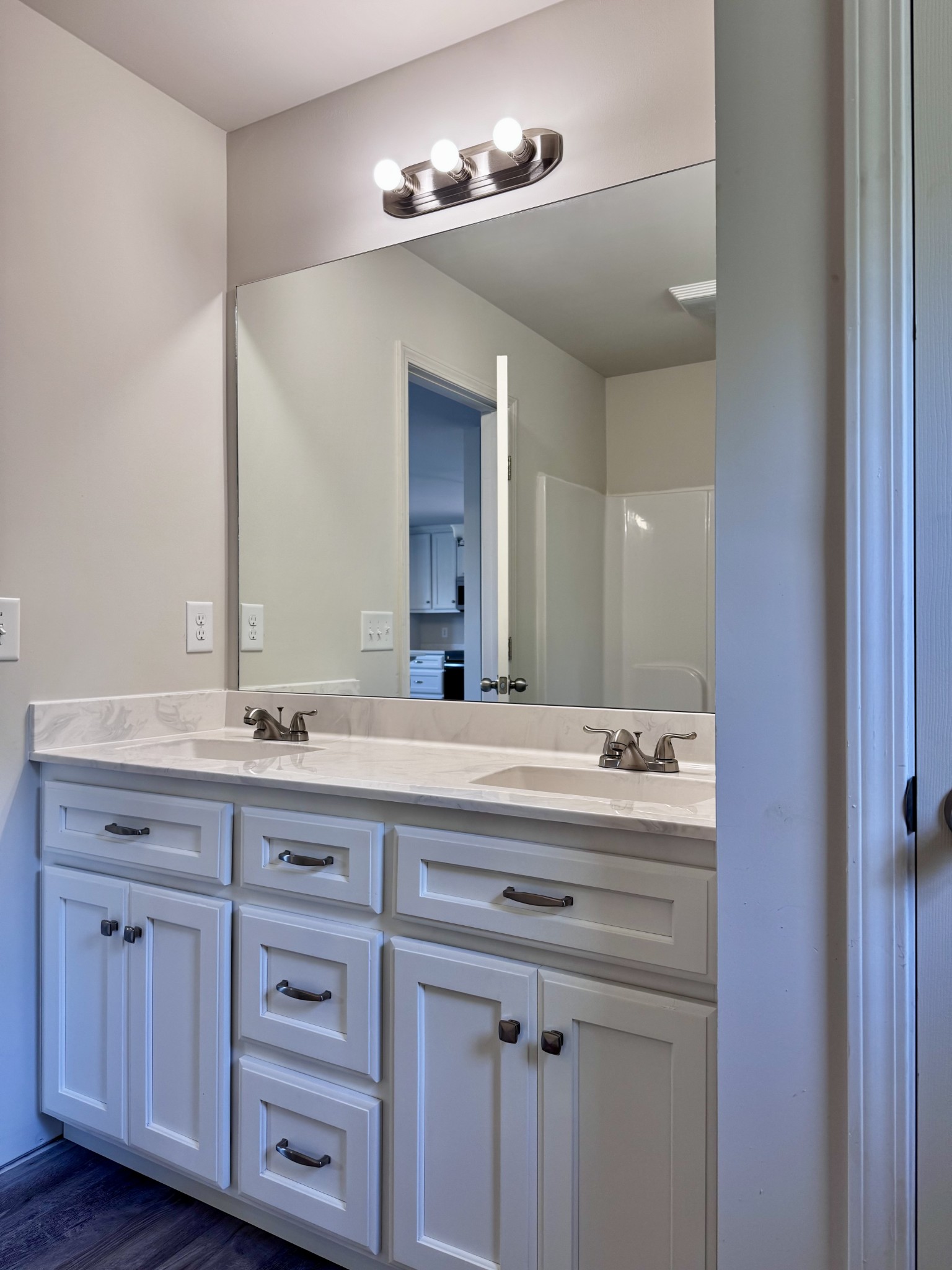 1122 Brannon Road Lawrenceburg, TN 38464 - Photo 13 of 21 a bathroom with a granite countertop double vanity sink and mirror