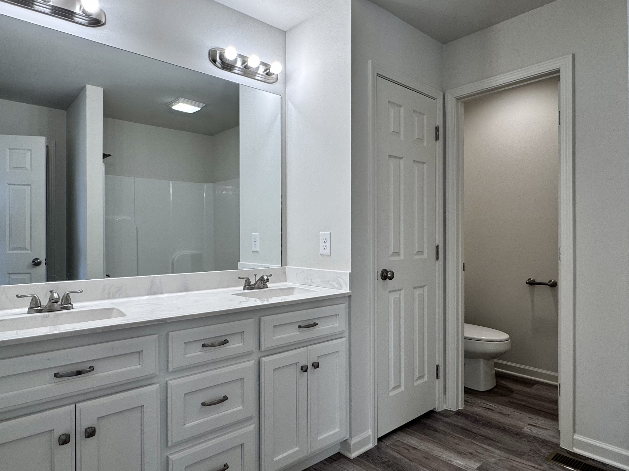 1122 Brannon Road Lawrenceburg, TN 38464 - Photo 14 of 21 a bathroom with a granite countertop sink toilet and shower