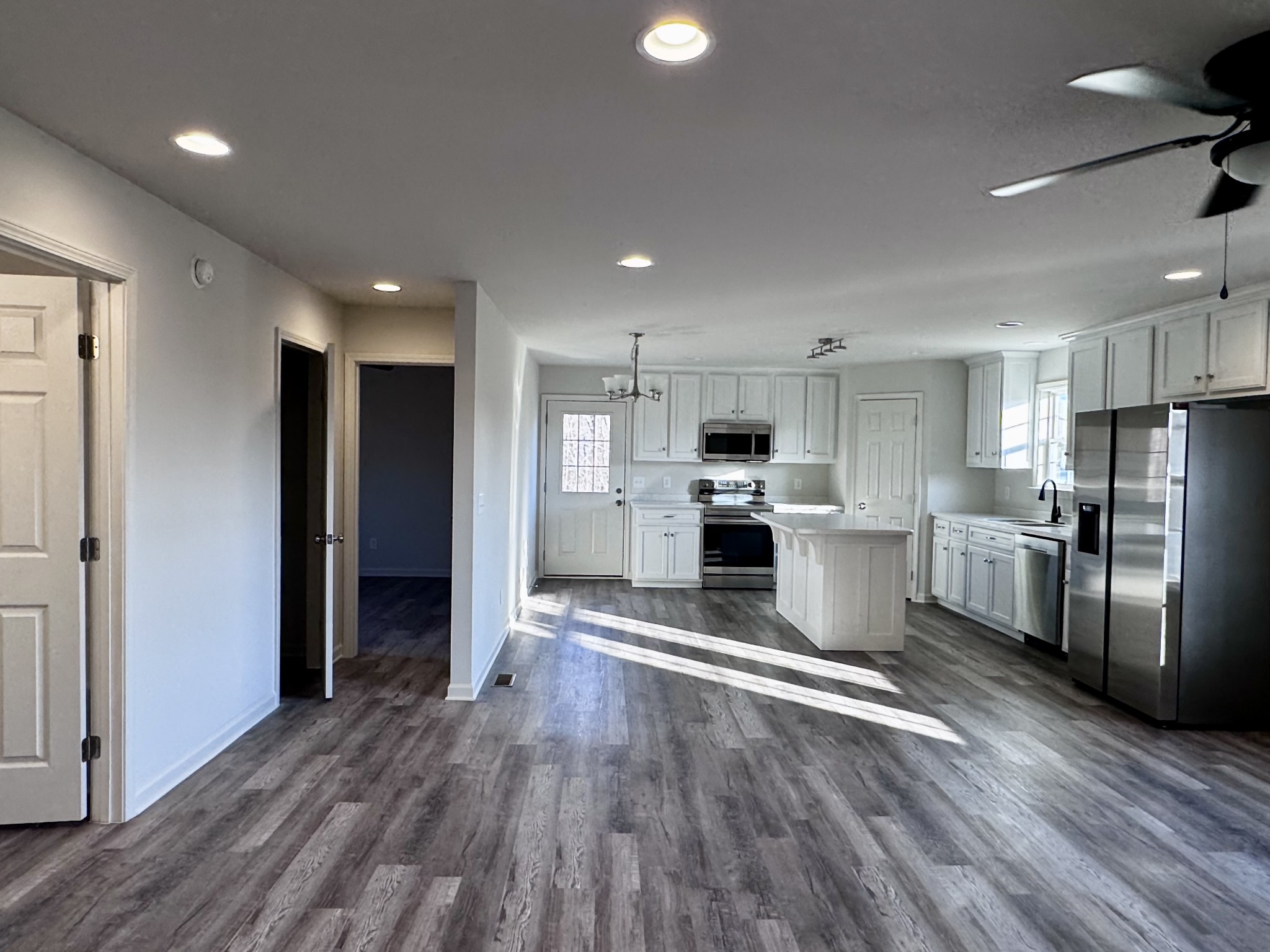 1122 Brannon Road Lawrenceburg, TN 38464 - Photo 2 of 21 a kitchen with refrigerator and cabinets