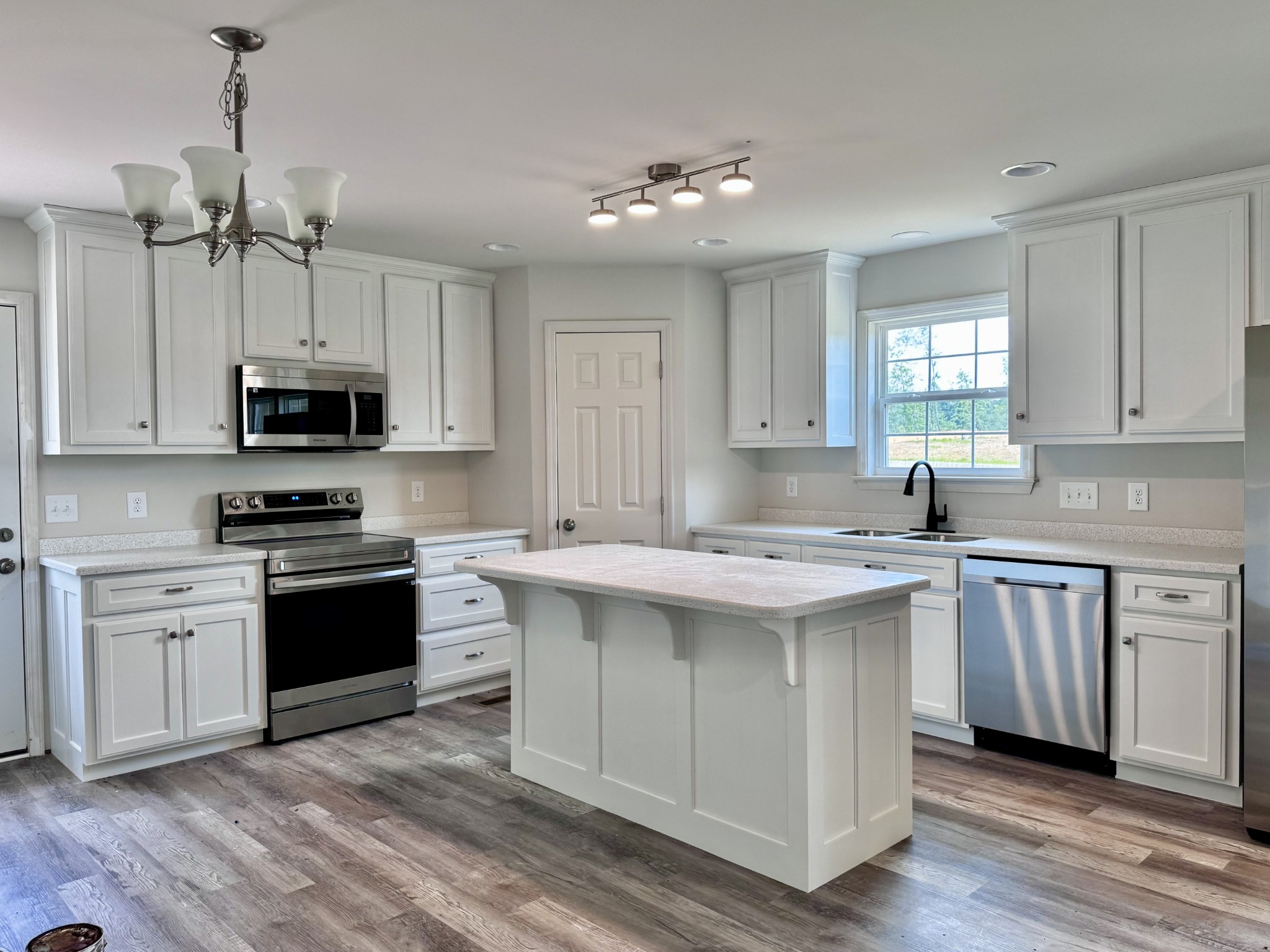 1122 Brannon Road Lawrenceburg, TN 38464 - Photo 4 of 21 a kitchen with a sink stove and microwave
