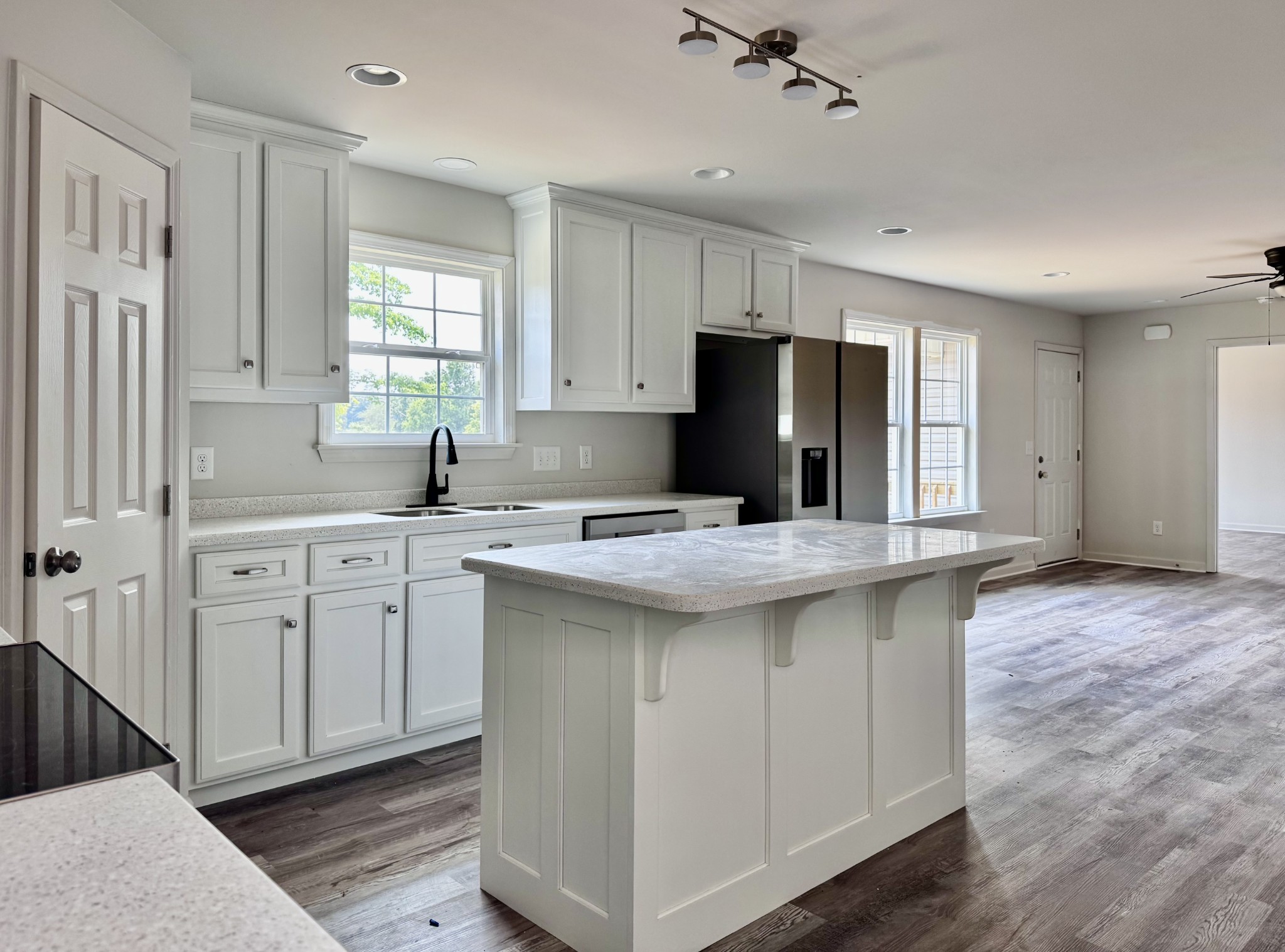 1122 Brannon Road Lawrenceburg, TN 38464 - Photo 5 of 21 a kitchen with kitchen island granite countertop a sink cabinets and stainless steel appliances