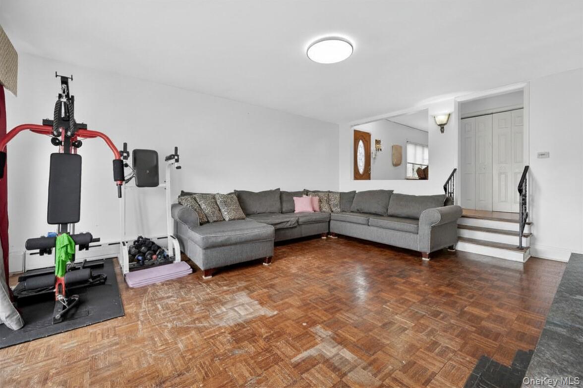 560 Locust Avenue Port Chester, NY 10573 - Photo 11 of 35 a living room with furniture and a chandelier