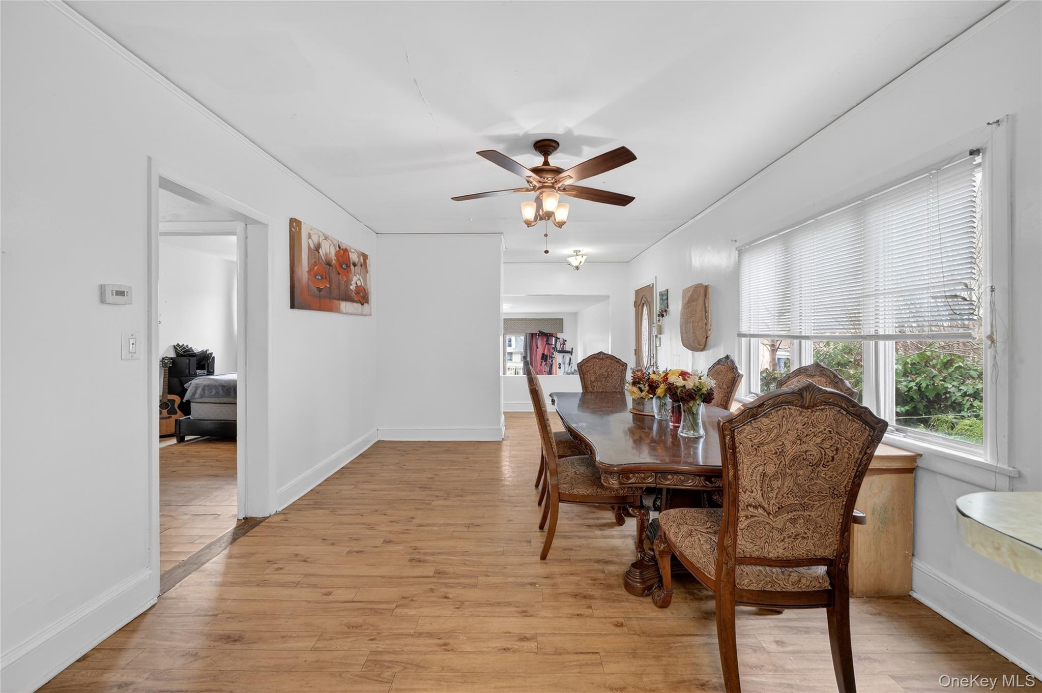 560 Locust Avenue Port Chester, NY 10573 - Photo 12 of 35 a view of a dining room with furniture and a chandelier