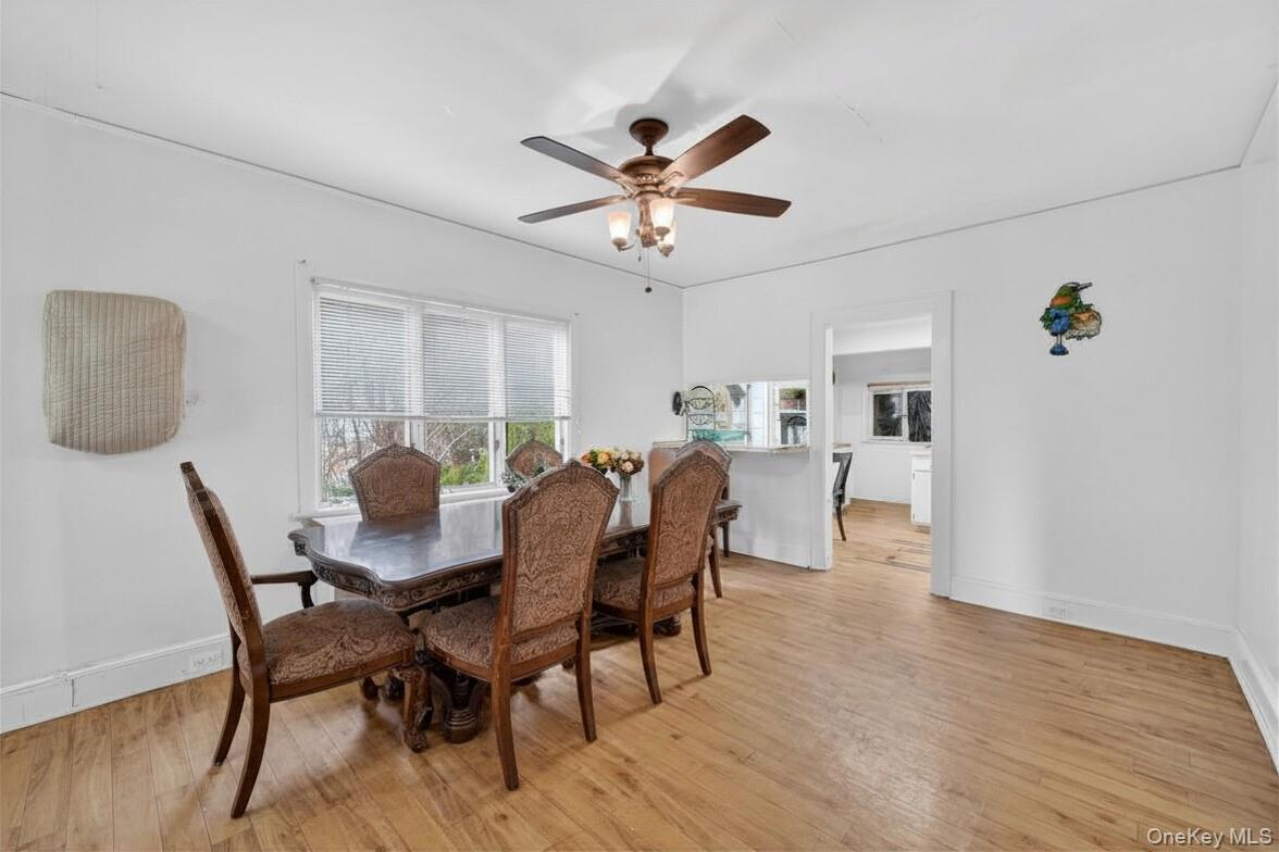 560 Locust Avenue Port Chester, NY 10573 - Photo 13 of 35 a view of a dining room with furniture and a chandelier