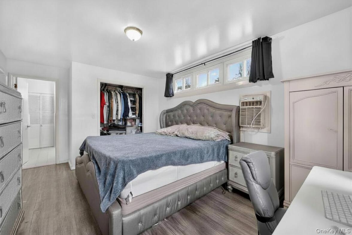 560 Locust Avenue Port Chester, NY 10573 - Photo 18 of 35 a bedroom with a bed and a flat screen tv