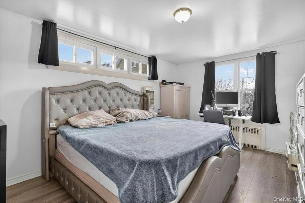 560 Locust Avenue Port Chester, NY 10573 - Photo 19 of 35 a bedroom with furniture and a flat screen tv