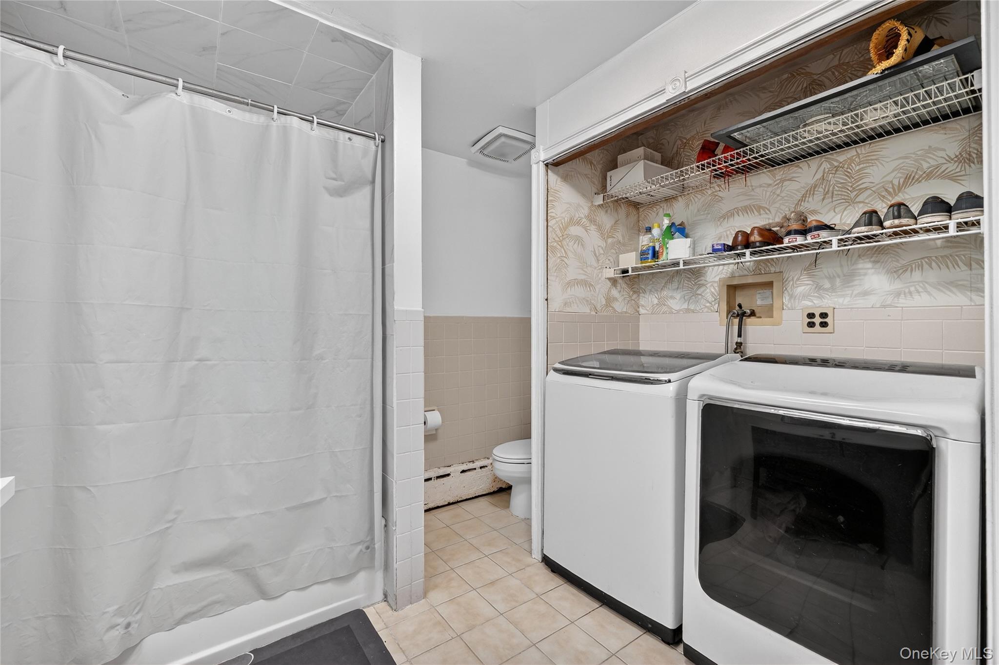 560 Locust Avenue Port Chester, NY 10573 - Photo 22 of 35 a utility room with dryer and washer