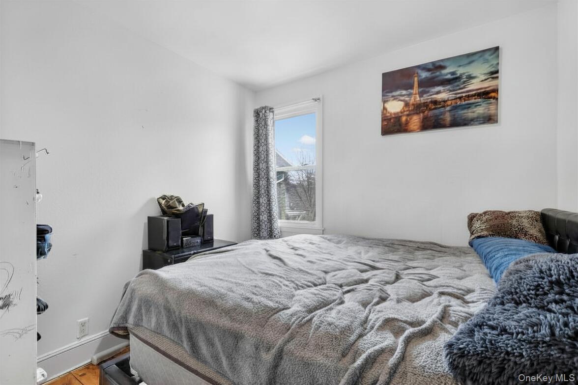 560 Locust Avenue Port Chester, NY 10573 - Photo 26 of 35 a bedroom with a bed and a couch