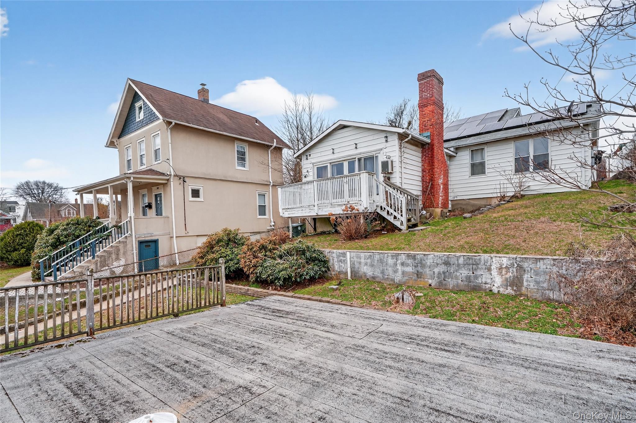 560 Locust Avenue Port Chester, NY 10573 - Photo 4 of 35 a front view of a house with a yard and potted plants
