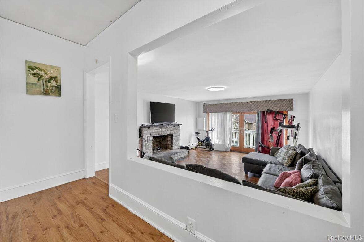 560 Locust Avenue Port Chester, NY 10573 - Photo 6 of 35 a living room with furniture and a fireplace