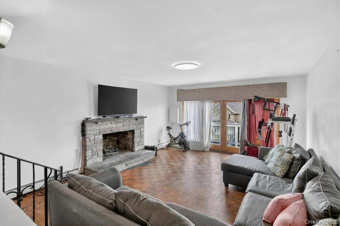 560 Locust Avenue Port Chester, NY 10573 - Photo 7 of 35 a living room with furniture fireplace and flat screen tv