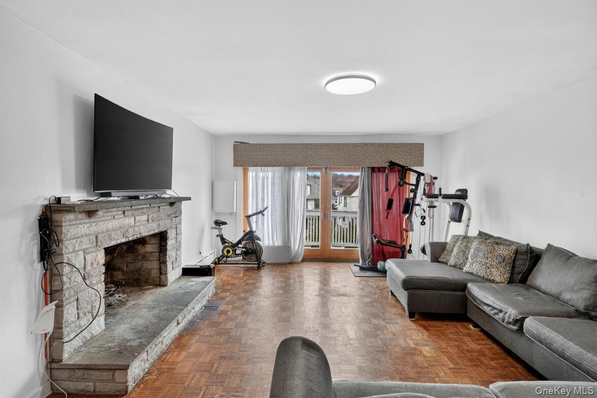 560 Locust Avenue Port Chester, NY 10573 - Photo 8 of 35 a living room with furniture and a fireplace