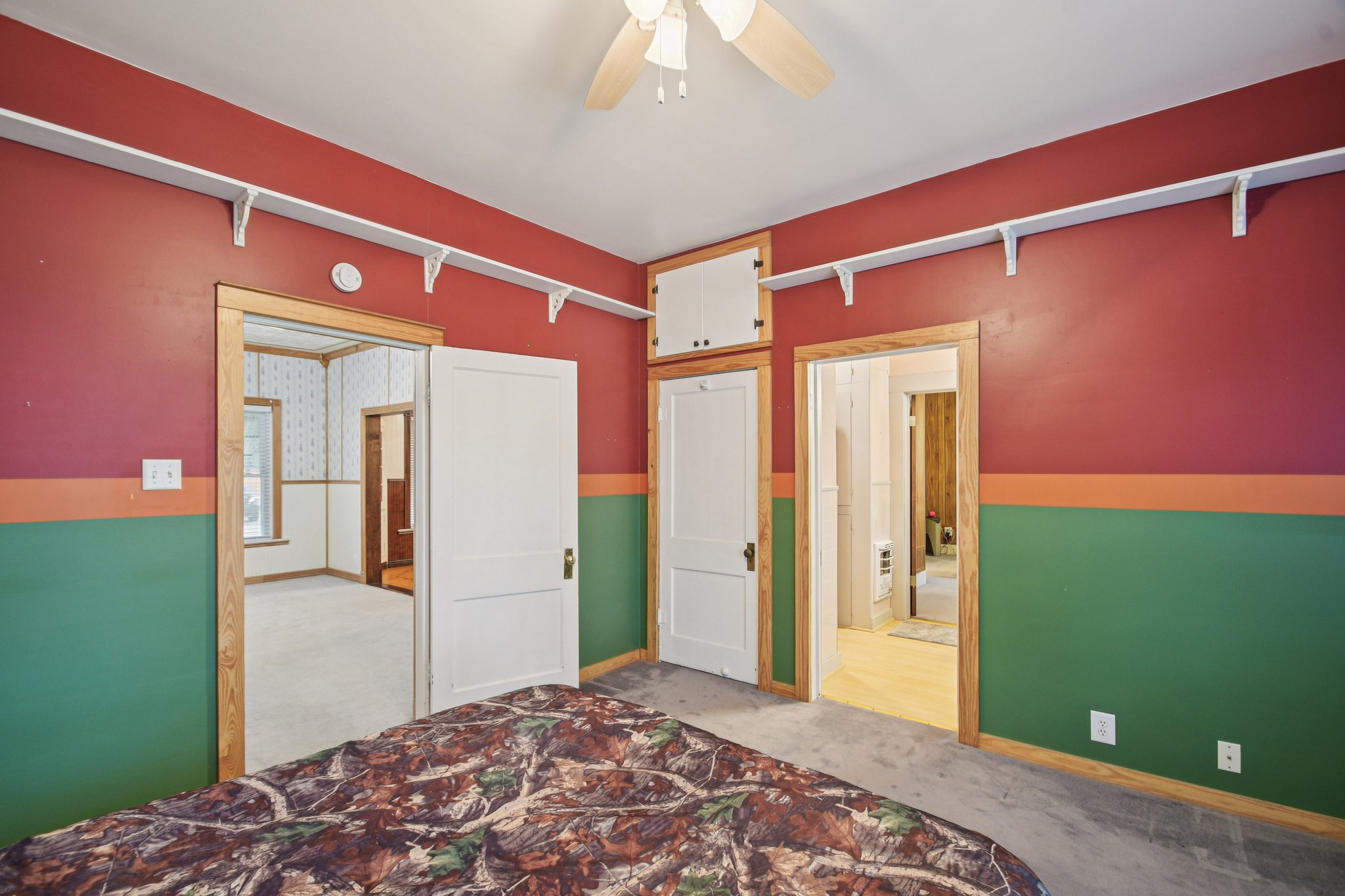 611 North Main Street Elgin, TX 78621 - Photo 15 of 26 a bedroom with a bed and a mirror