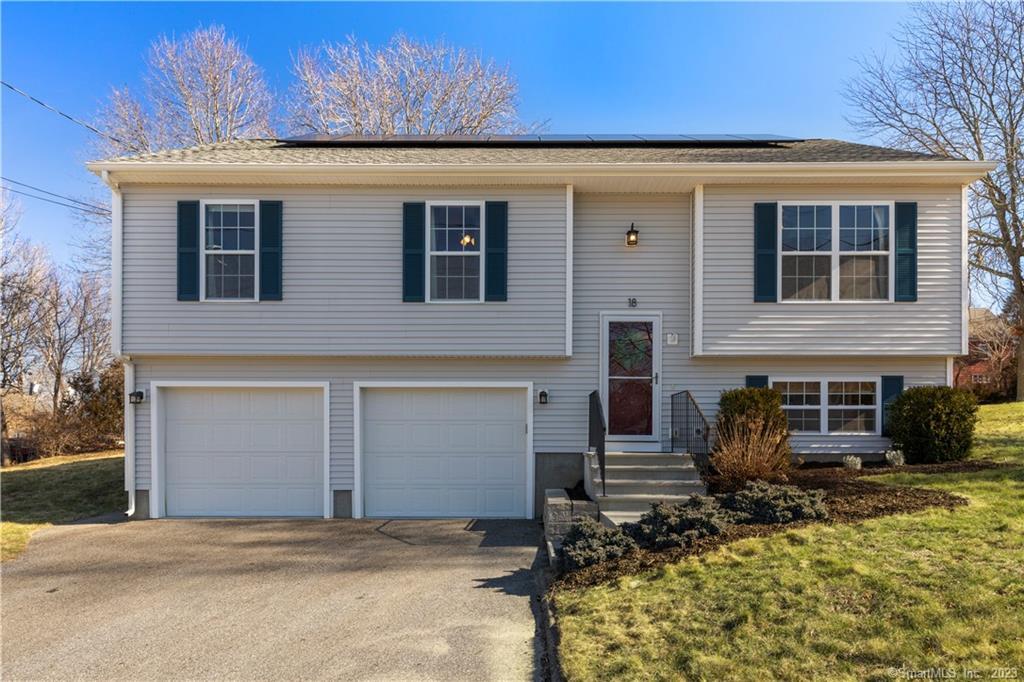a front view of a house with large windows