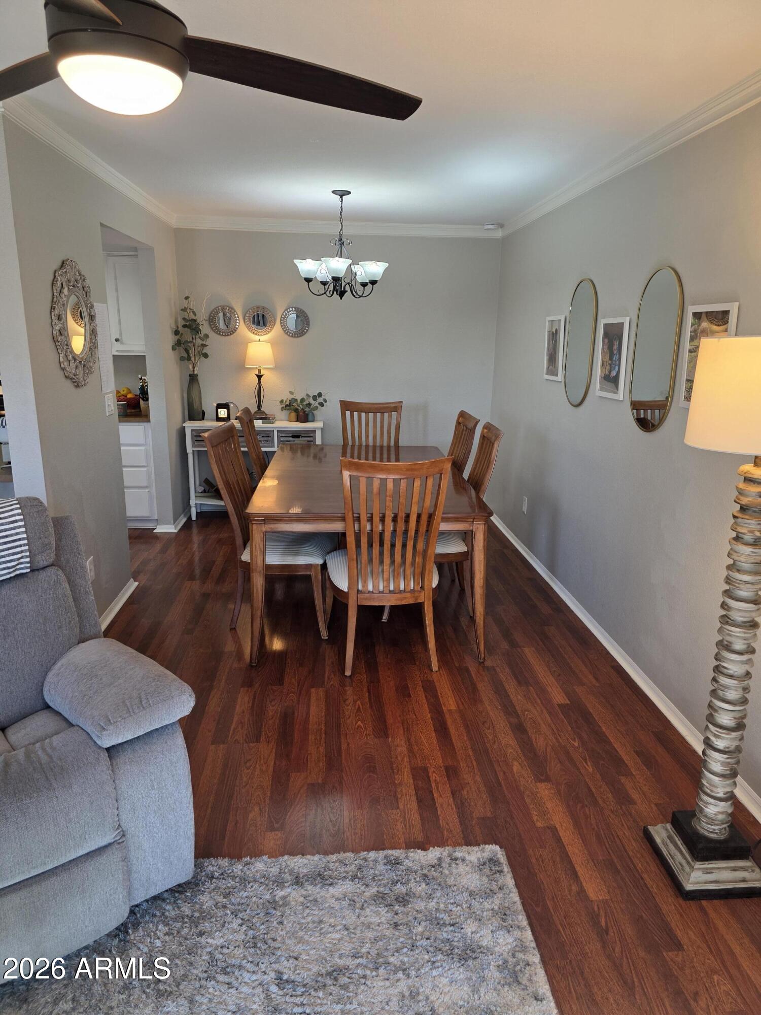 222 West Brown Road, Unit 107 Mesa, AZ 85201 - Photo 7 of 24 a living room with furniture dining table and wooden floor